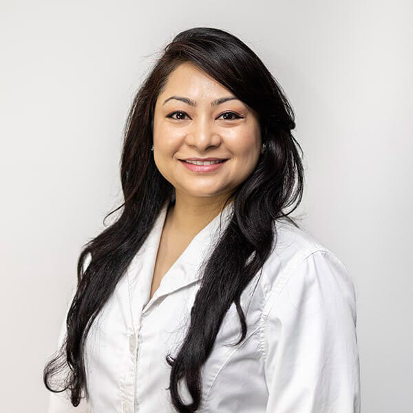 Dr. Manisha Shrestha, one of our specialists in Reston Family Smiles smiling